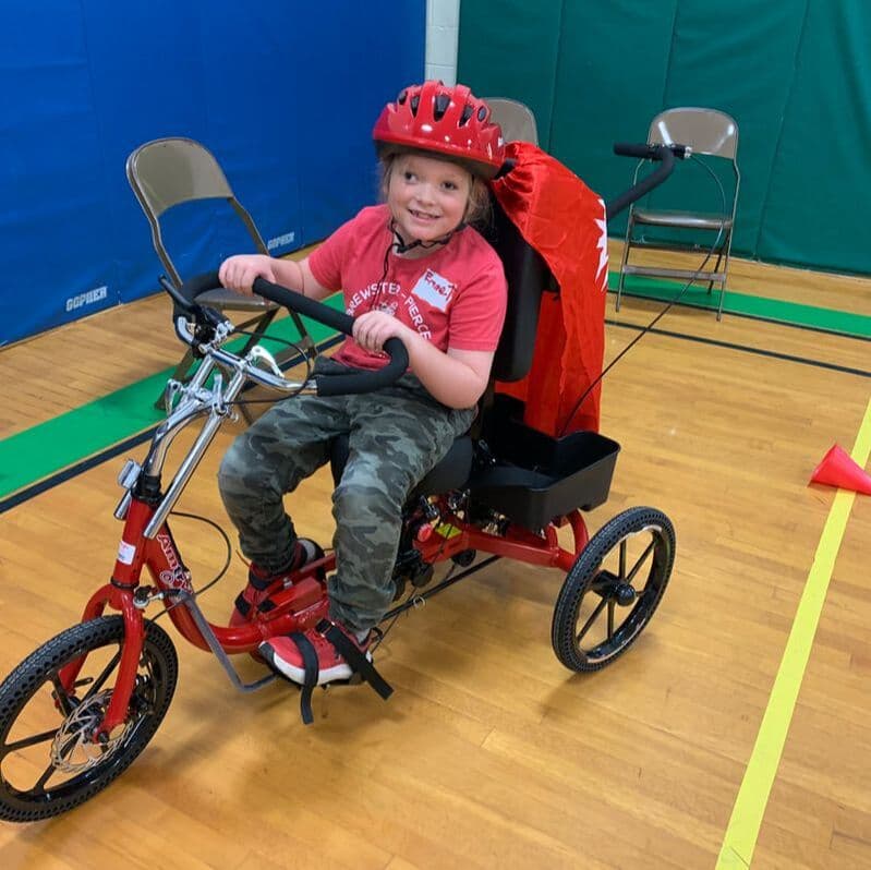 Rider being fitted for an AmTryke at Vermont AMBUCS mini-fitting event